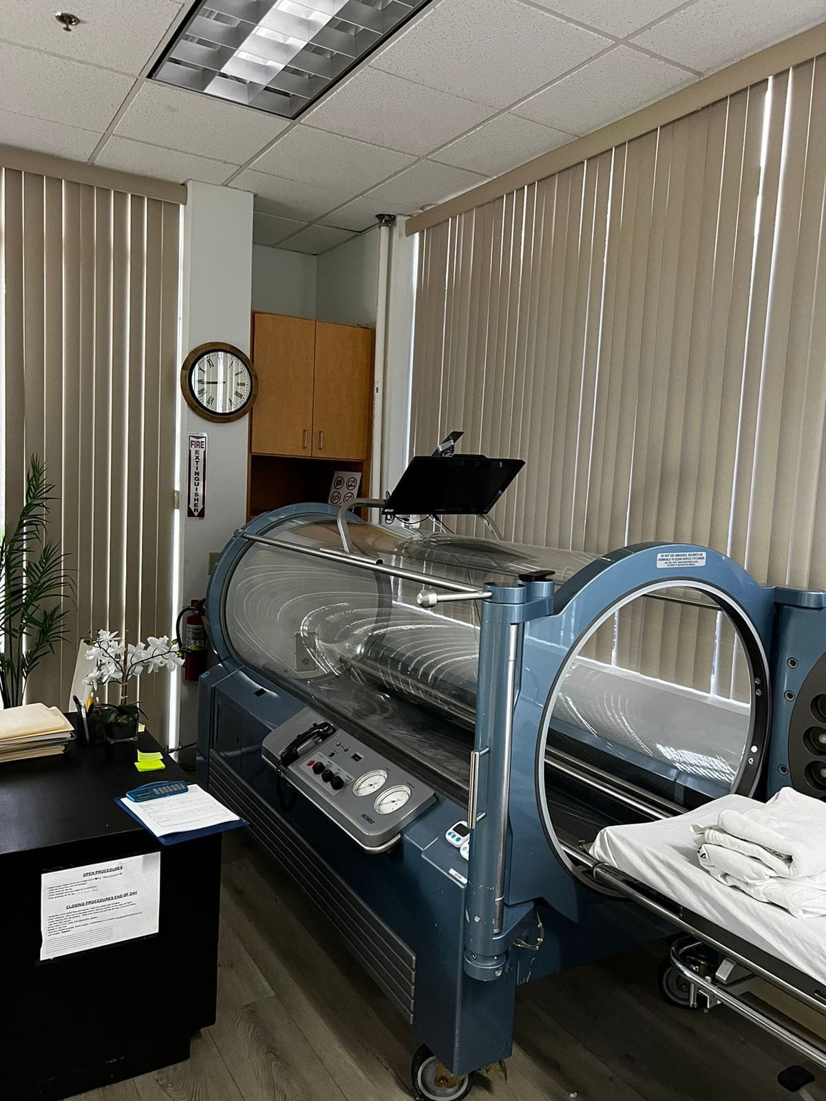 Medical-grade hyperbaric chamber in a spacious treatment room at Pacific Hyperbarics — Oceanside